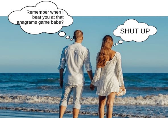 Competitive couple together on beach with the man bragging about when he won the Valentine's Day game
